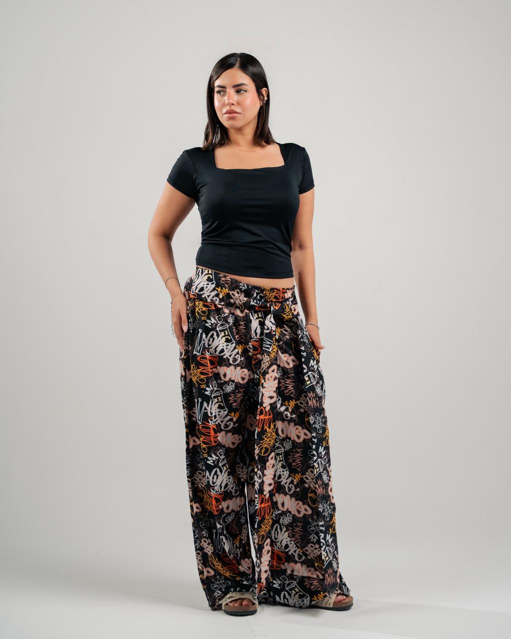 Graffiti Print Wide-Leg Pants in Black - front