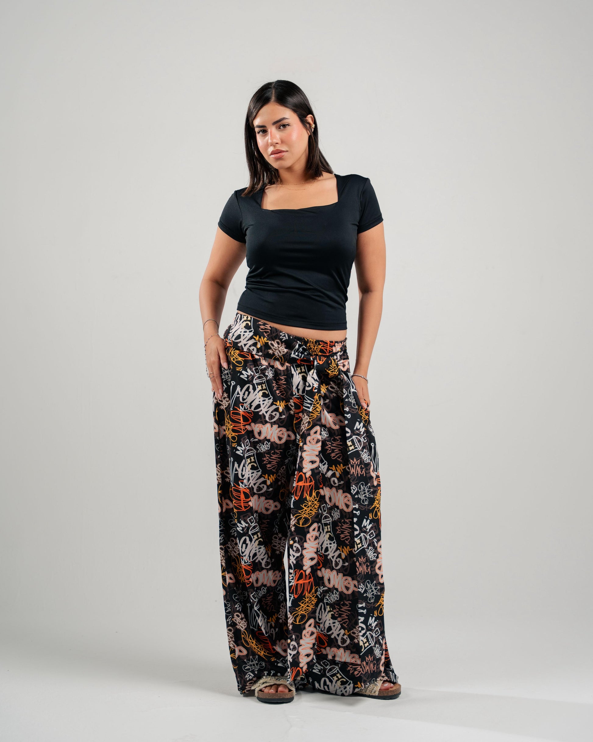 Graffiti Print Wide-Leg Pants in Black - front view